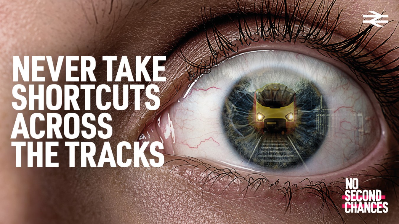 Close-up of an eye with a digital overlay of a train reflected in the iris and bold white text on the left.