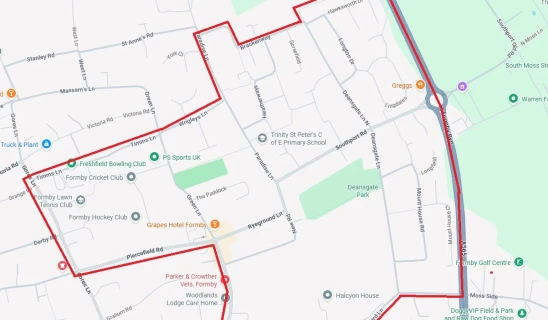 Map view showing a red outlined boundary over streets and parks in Formby area.