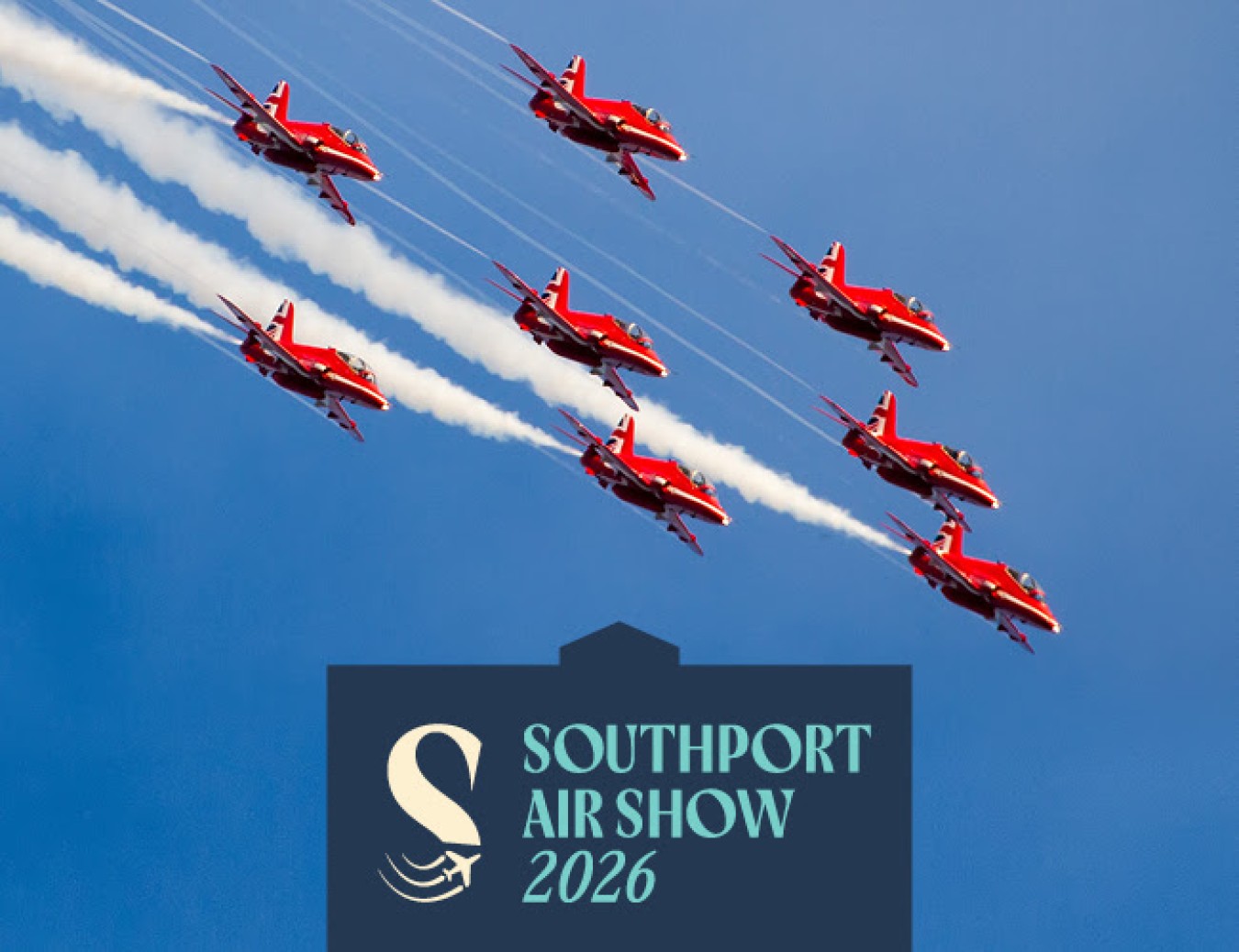 Formation of red aerobatic aircrafts in a blue sky with smoke trails above a Southport Air Show 2026 sign