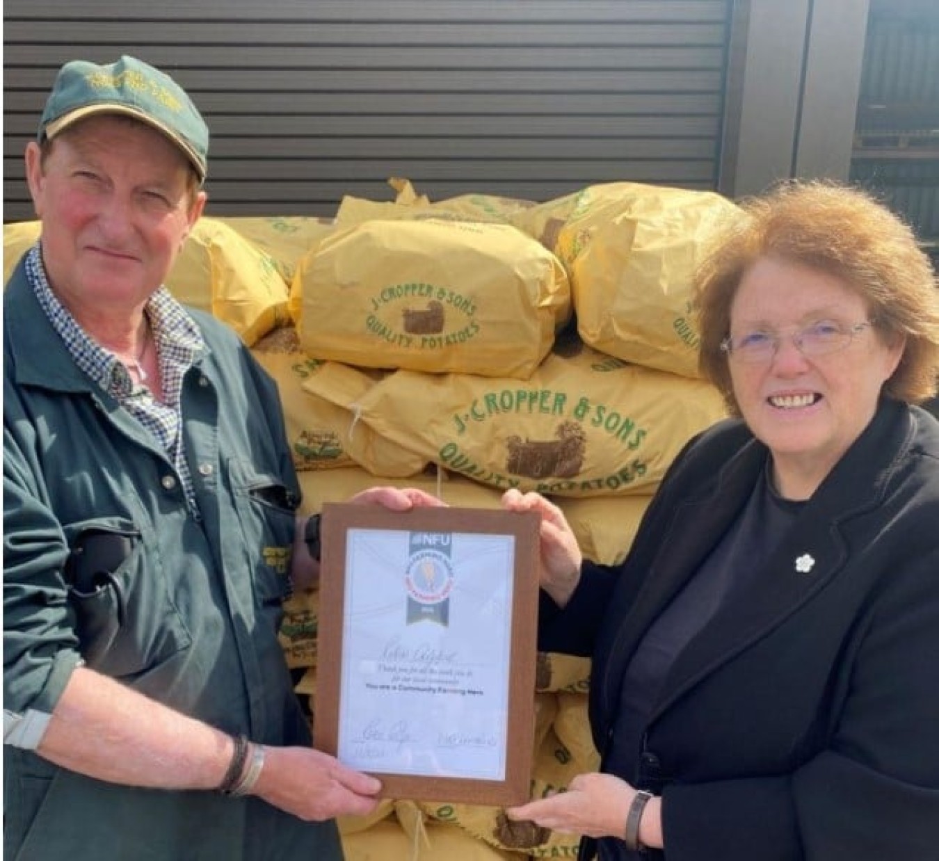 Rosie presents award to local farmer