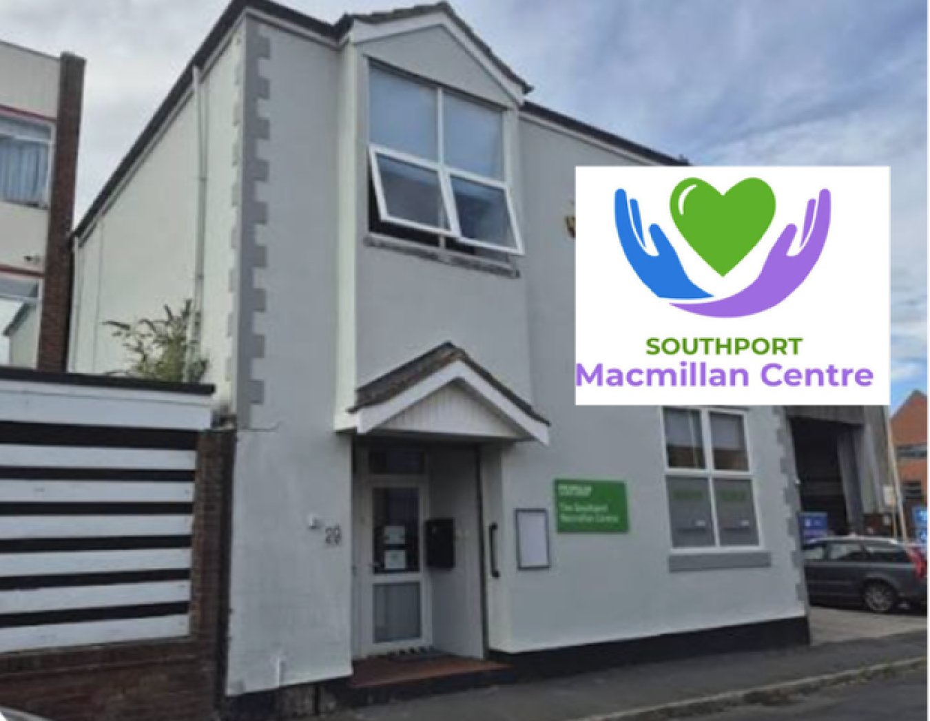 Two-storey white building with a grey roof, signboard and window, Macmillan Centre logo overlay on the right side