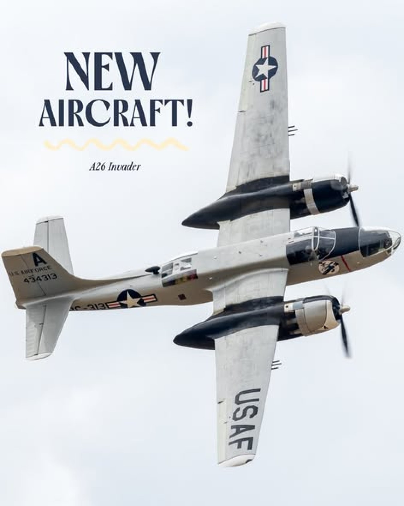 New Aircraft! A26 Invader aircraft in midflight with USAF markings against cloudy sky.