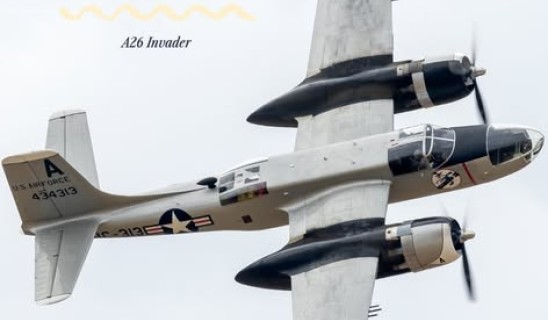 New Aircraft! A26 Invader aircraft in midflight with USAF markings against cloudy sky.