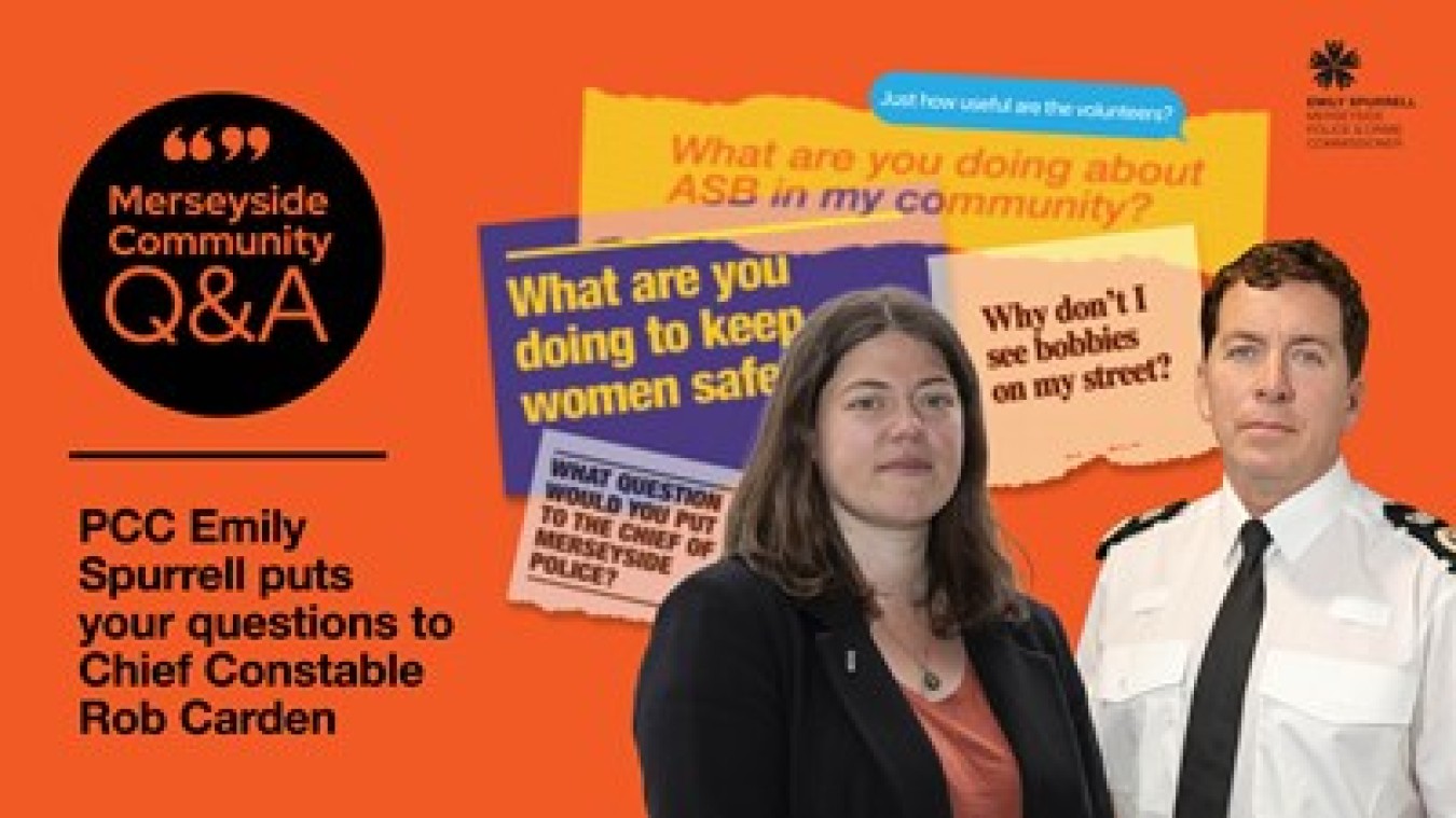 Two people stand before an orange wall with posters about ASB and community safety.