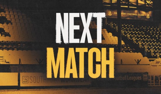 Stadium seating and pitch area with bold white and yellow “NEXT MATCH” text overlay