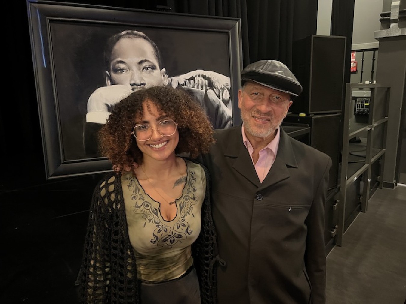 two people stood in front of a painting