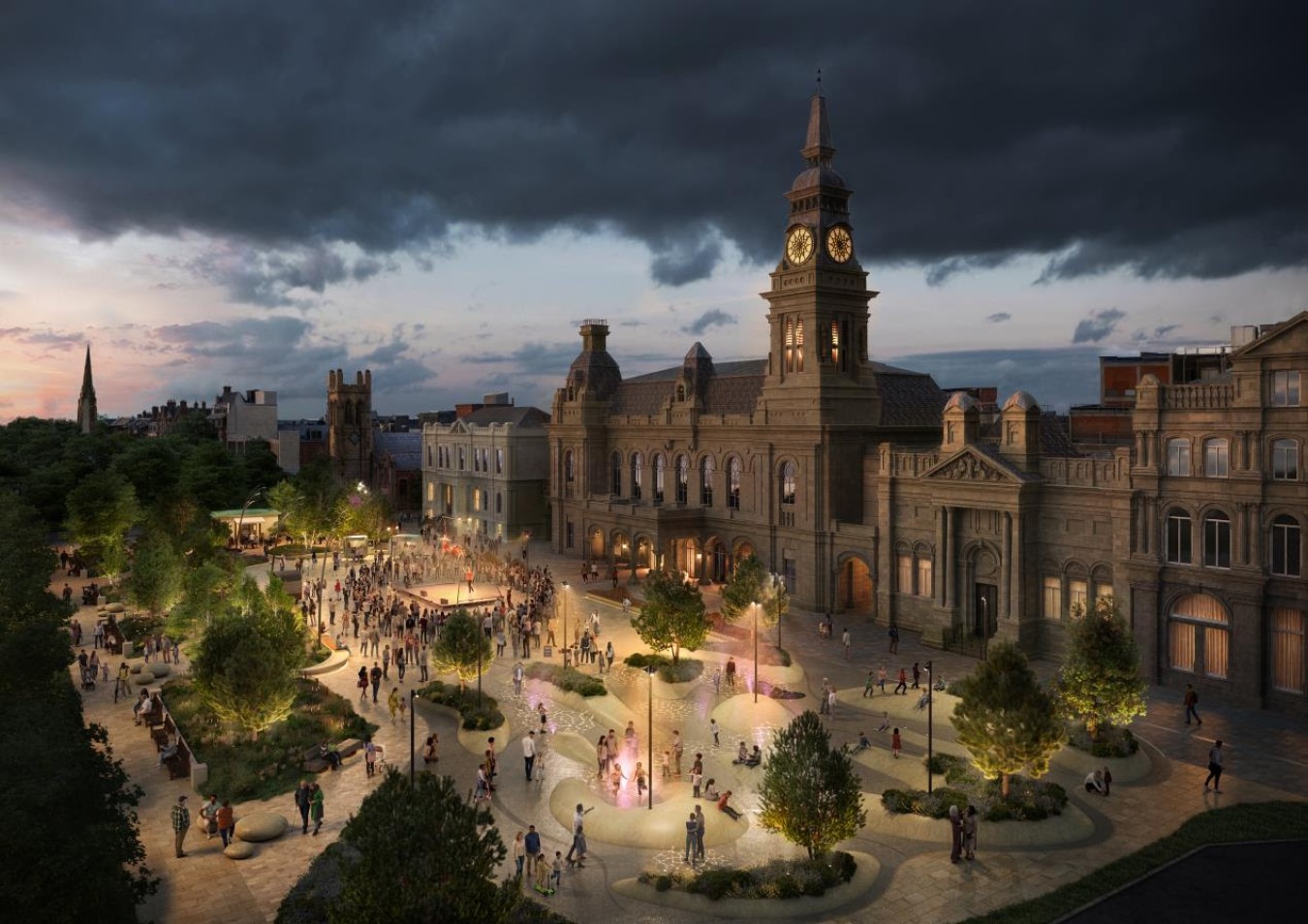 Historic town square with a large ornate building and clock tower, evening crowd around a circular plaza with illuminated fountains.