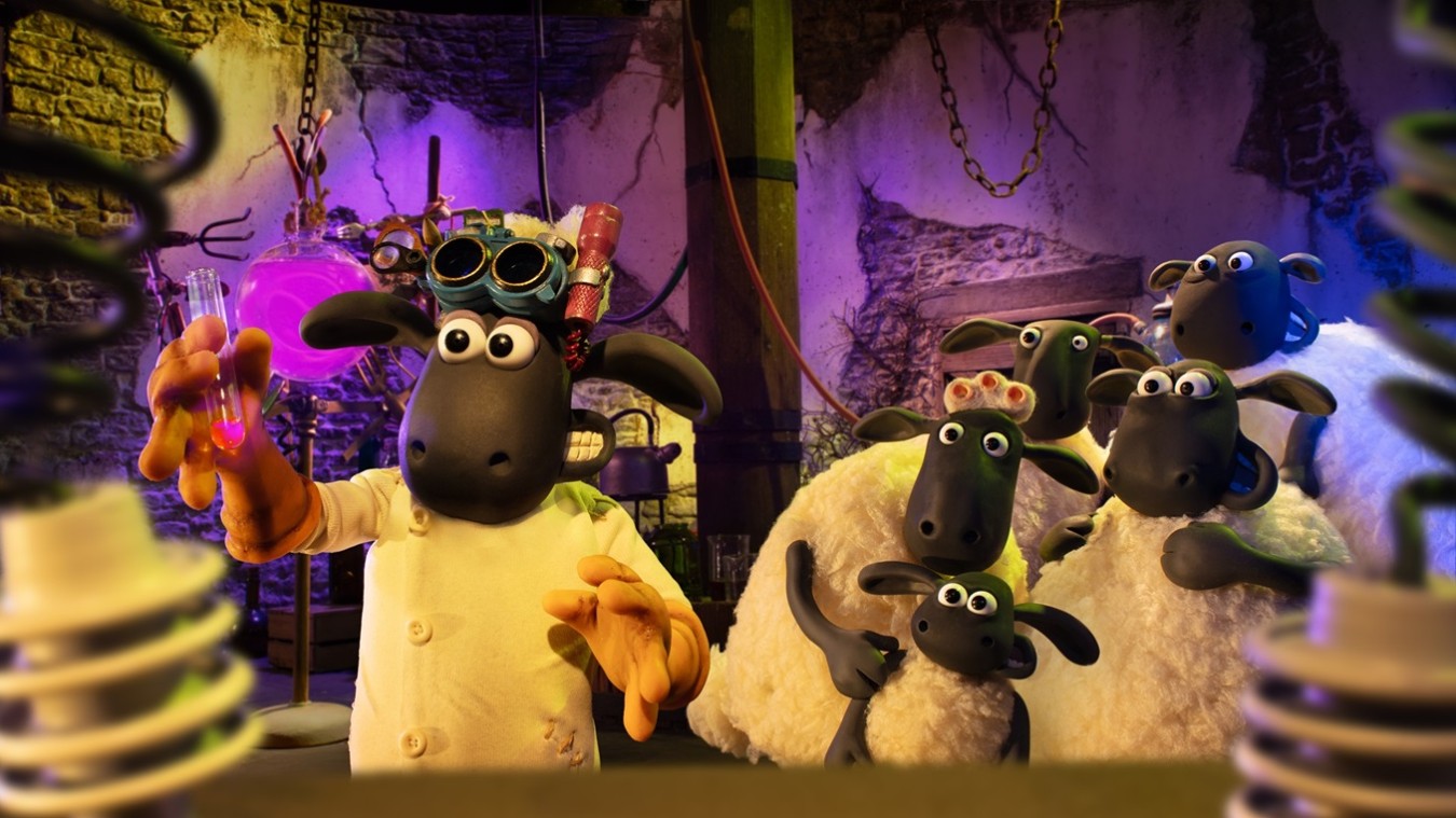 Lab scene with a black sheep wearing goggles and a white coat, holding a pink liquid in a test tube, surrounded by several other sheep characters in a dim, colorful lab setting.