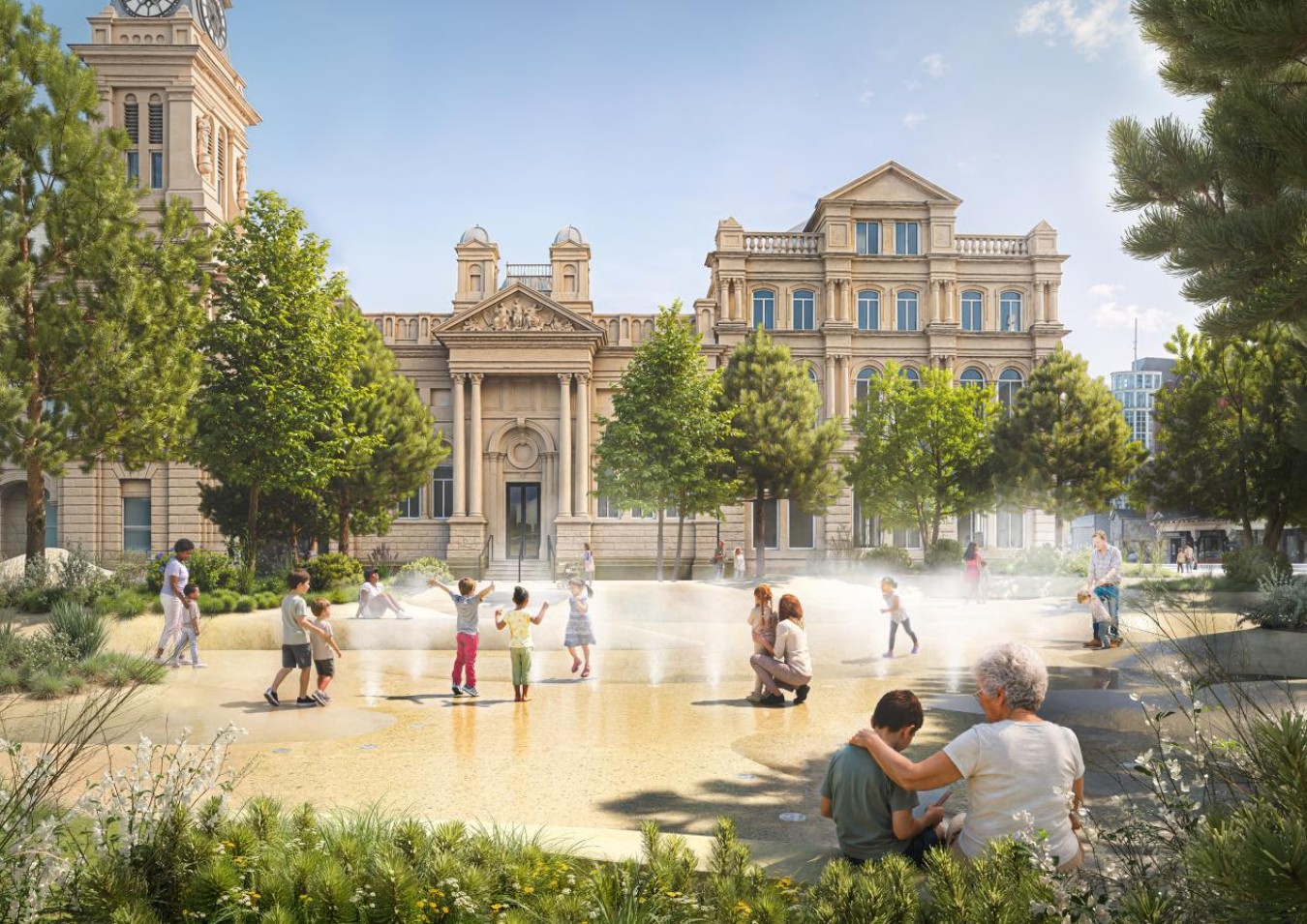 Historic building with clock tower and trees, children playing in a shallow fountain courtyard.